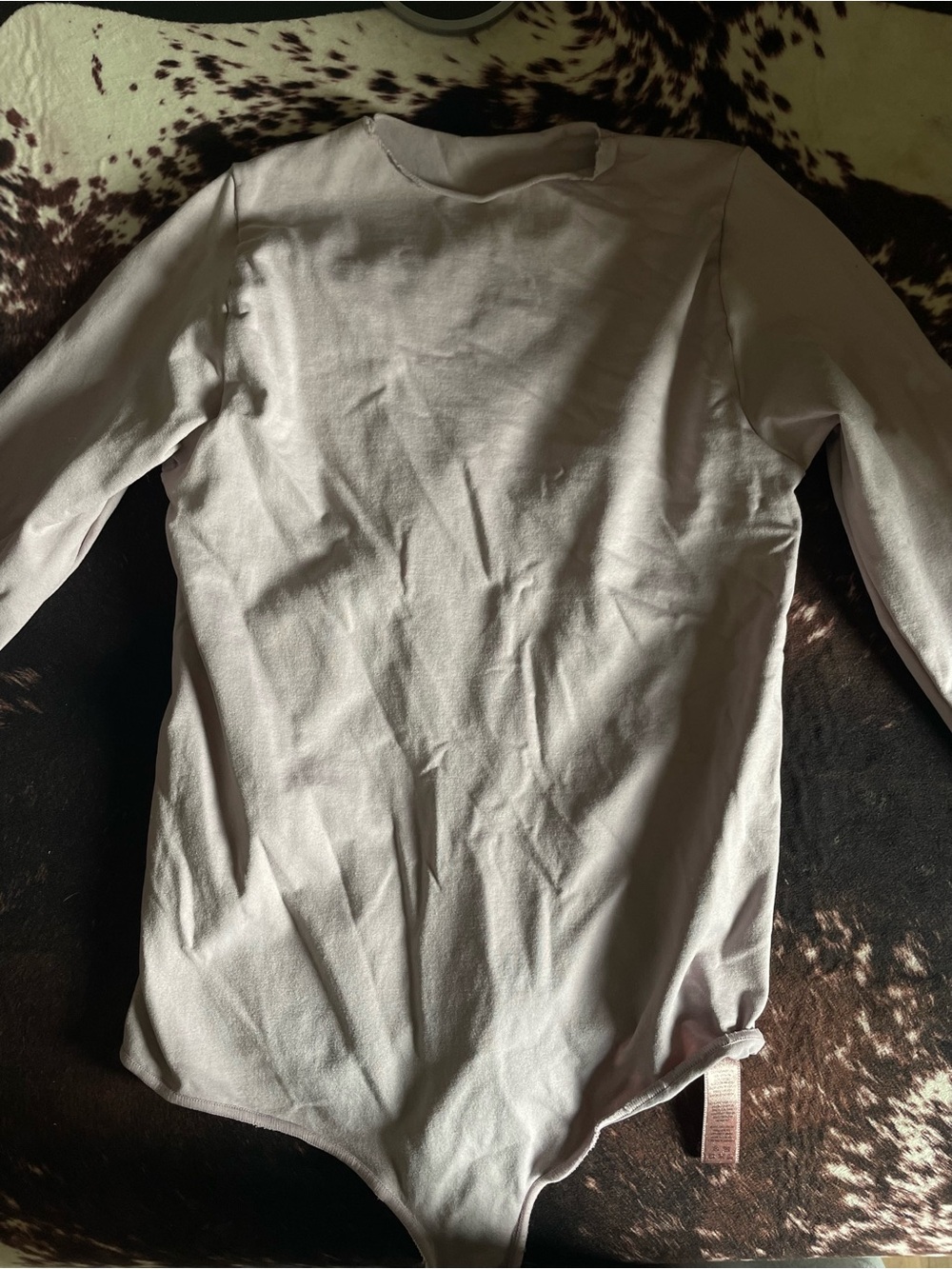 SKIMS Long Sleeve Crewneck Bodysuit in mauve pink
